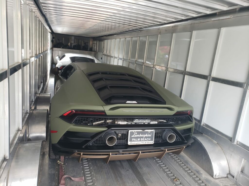 Car being shipped via enclosed transport